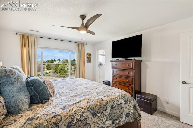 carpeted bedroom featuring a ceiling fan, baseboards, and visible vents