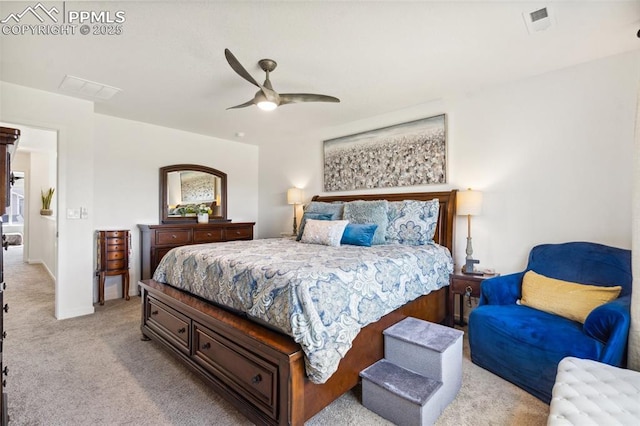 bedroom with visible vents, baseboards, ceiling fan, and light carpet