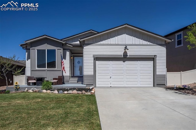 ranch-style home featuring an attached garage, driveway, and board and batten siding