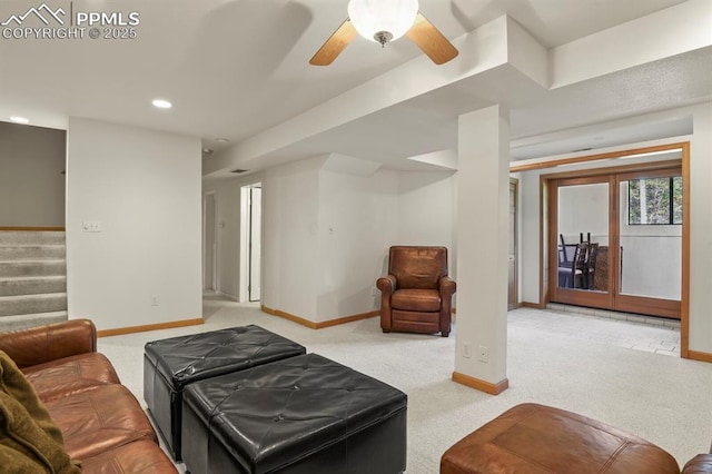 living room featuring stairway, carpet, and baseboards