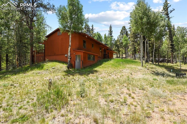 view of property exterior featuring fence