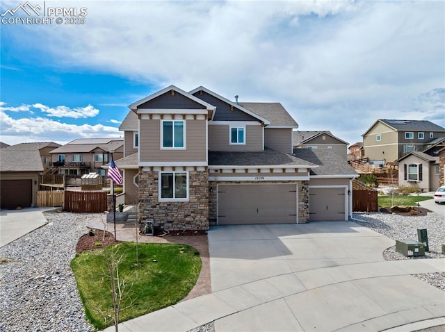 12529 Culebra Peak Dr, Peyton, CO 80831 - craftsman house with driveway, stone siding, a shingled roof, fence, and a residential view