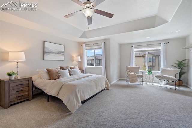 12529 Culebra Peak Dr, Peyton, CO 80831 - carpeted bedroom featuring ceiling fan, baseboards, and a raised ceiling
