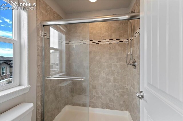12529 Culebra Peak Dr, Peyton, CO 80831 - bathroom featuring a shower stall and toilet