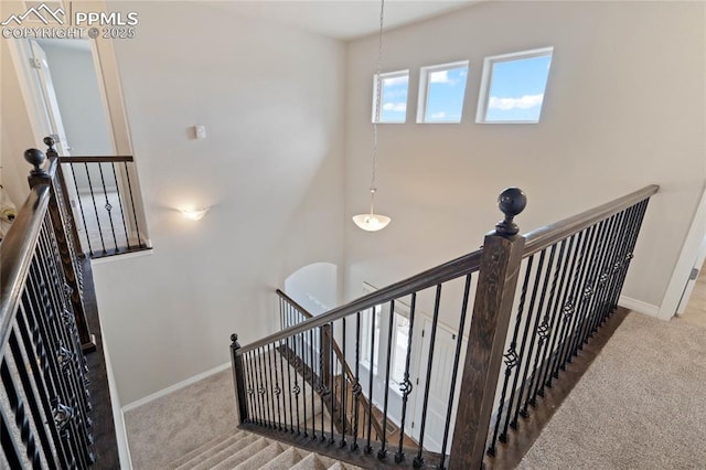 12529 Culebra Peak Dr, Peyton, CO 80831 - staircase with baseboards and carpet