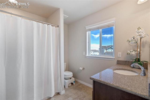 12529 Culebra Peak Dr, Peyton, CO 80831 - full bathroom with baseboards, toilet, and vanity