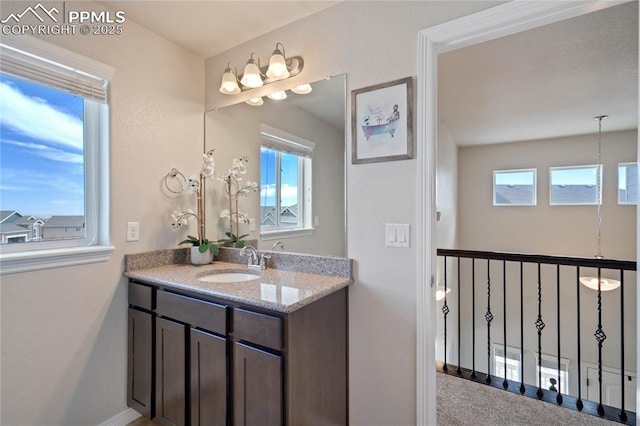 12529 Culebra Peak Dr, Peyton, CO 80831 - bathroom with baseboards and vanity