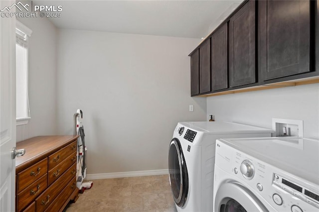 12529 Culebra Peak Dr, Peyton, CO 80831 - washroom featuring baseboards, cabinet space, and independent washer and dryer