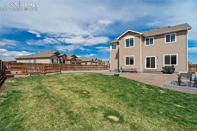 12529 Culebra Peak Dr, Peyton, CO 80831 - rear view of property with a patio area, a fenced backyard, entry steps, and a yard