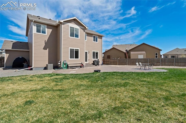 12529 Culebra Peak Dr, Peyton, CO 80831 - back of property featuring a yard, fence, and a patio area
