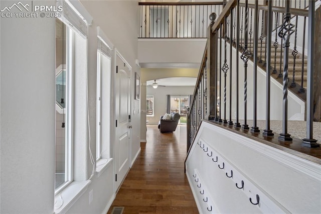 12529 Culebra Peak Dr, Peyton, CO 80831 - corridor with stairway, baseboards, wood finished floors, and a high ceiling