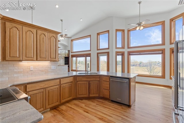 18 Redondo Ln, Pueblo, CO 81005 - kitchen featuring stainless steel dishwasher, a peninsula, a sink, and a ceiling fan