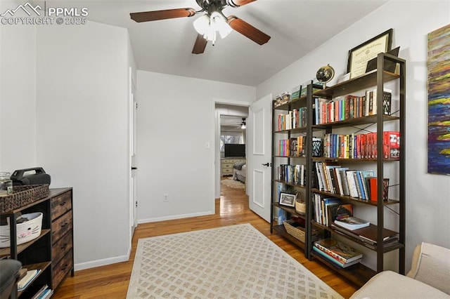 219 Fairfax St, Colorado Springs, CO 80911 - living area with wood finished floors, baseboards, and ceiling fan