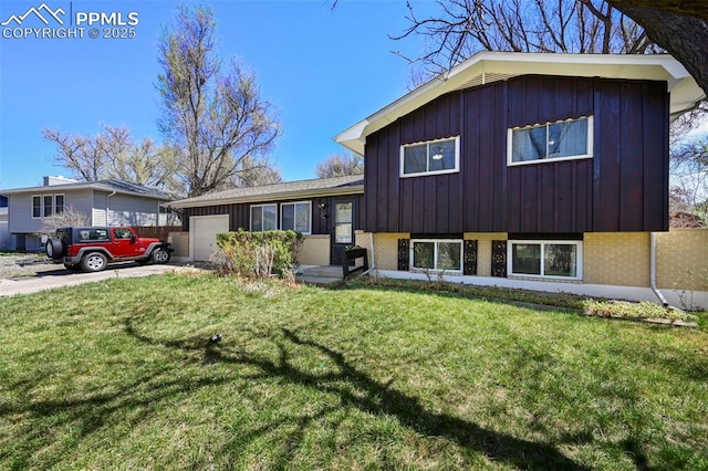 219 Fairfax St, Colorado Springs, CO 80911 - tri-level home with concrete driveway, an attached garage, board and batten siding, and a front yard