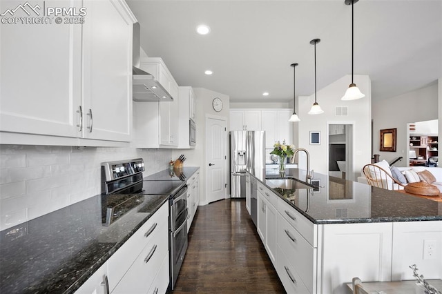 4225 New Santa Fe Trl, Colorado Springs, CO 80924 - kitchen featuring stainless steel appliances, a sink, tasteful backsplash, a kitchen island with sink, and white cabinetry