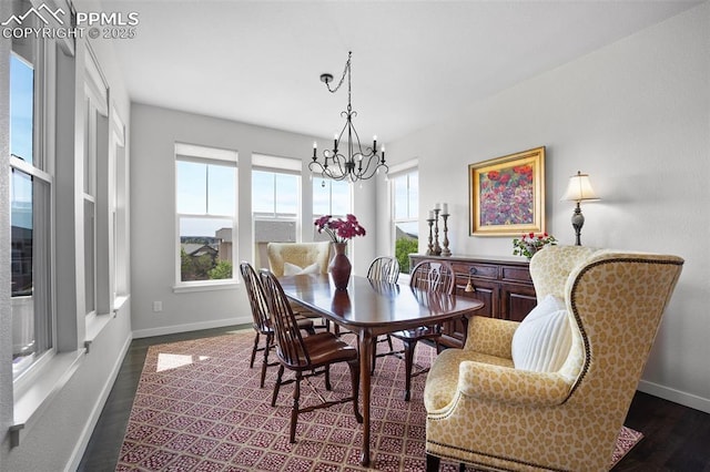 4225 New Santa Fe Trl, Colorado Springs, CO 80924 - dining area featuring a chandelier, dark wood-style floors, and baseboards