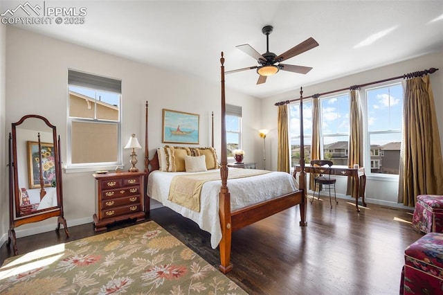 4225 New Santa Fe Trl, Colorado Springs, CO 80924 - bedroom with wood finished floors, multiple windows, baseboards, and ceiling fan