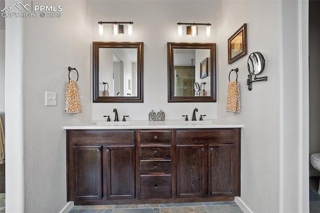 4225 New Santa Fe Trl, Colorado Springs, CO 80924 - bathroom with double vanity, baseboards, and toilet