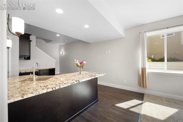 4225 New Santa Fe Trl, Colorado Springs, CO 80924 - kitchen with a sink, dark wood-style flooring, baseboards, recessed lighting, and a peninsula