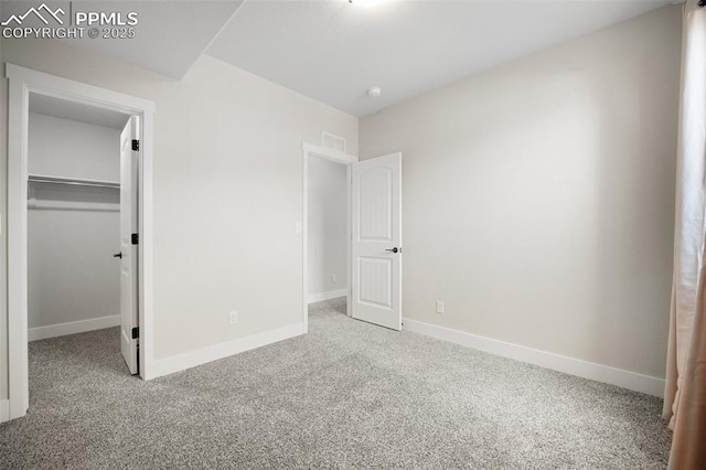 4225 New Santa Fe Trl, Colorado Springs, CO 80924 - unfurnished bedroom featuring carpet flooring, a walk in closet, and baseboards