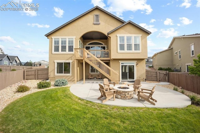 4225 New Santa Fe Trl, Colorado Springs, CO 80924 - rear view of house with an outdoor fire pit, stairs, a patio area, stucco siding, and a gate
