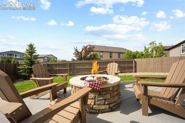 4225 New Santa Fe Trl, Colorado Springs, CO 80924 - fenced backyard featuring an outdoor fire pit, a patio, and a residential view
