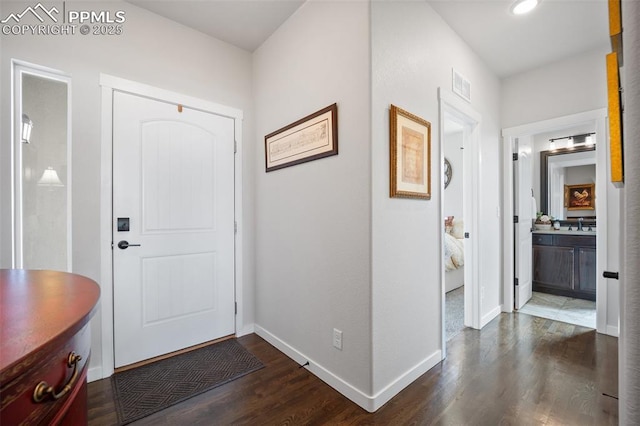 4225 New Santa Fe Trl, Colorado Springs, CO 80924 - entrance foyer featuring dark wood-style flooring and baseboards