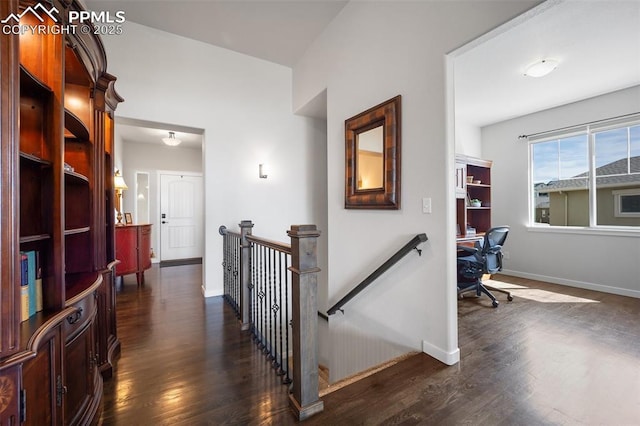 4225 New Santa Fe Trl, Colorado Springs, CO 80924 - hallway with an upstairs landing, dark wood-type flooring, a desk, and baseboards