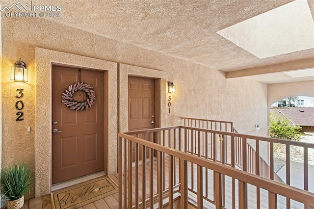 1530 Little Bear Creek Pt Unit 302, Colorado Springs, CO 80904 - entrance to property with a balcony and stucco siding