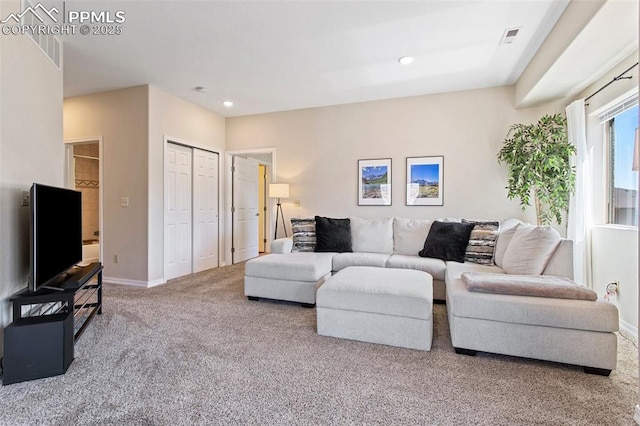 1530 Little Bear Creek Pt Unit 302, Colorado Springs, CO 80904 - carpeted living room with baseboards, recessed lighting, and visible vents