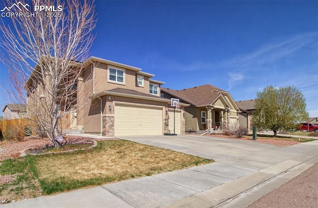 10585 Abrams Dr, Colorado Springs, CO 80925 - view of front of house with an attached garage, driveway, stucco siding, and stone siding