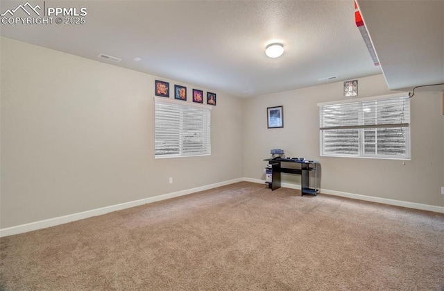 10585 Abrams Dr, Colorado Springs, CO 80925 - carpeted spare room with baseboards and visible vents