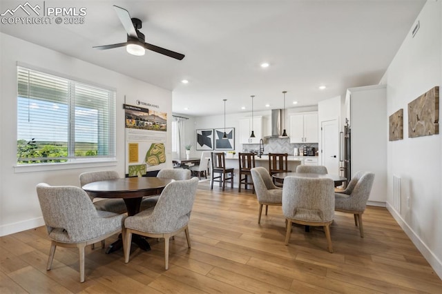 dining area featuring baseboards, recessed lighting, visible vents, ceiling fan, and light wood finished floors