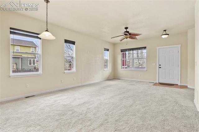 147 Celestine St, Colorado Springs, CO 80905 - unfurnished living room with baseboards, a ceiling fan, visible vents, and carpet