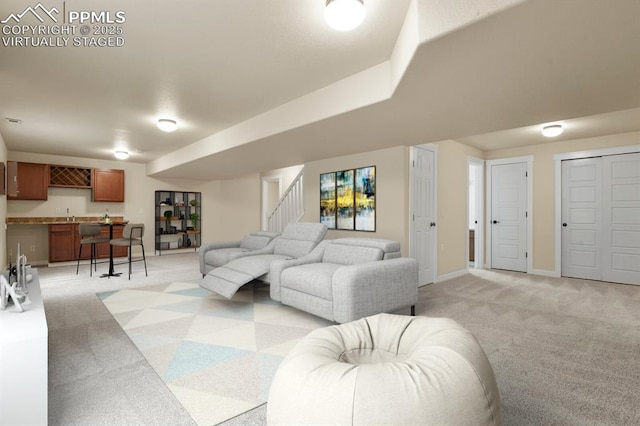 147 Celestine St, Colorado Springs, CO 80905 - living area with indoor bar, light carpet, baseboards, and stairway