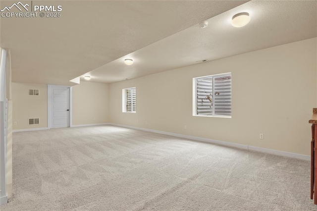 147 Celestine St, Colorado Springs, CO 80905 - below grade area with visible vents, baseboards, and light carpet