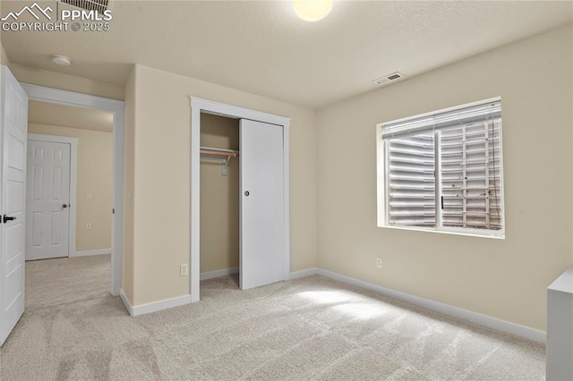 147 Celestine St, Colorado Springs, CO 80905 - unfurnished bedroom with baseboards, visible vents, a closet, and carpet flooring