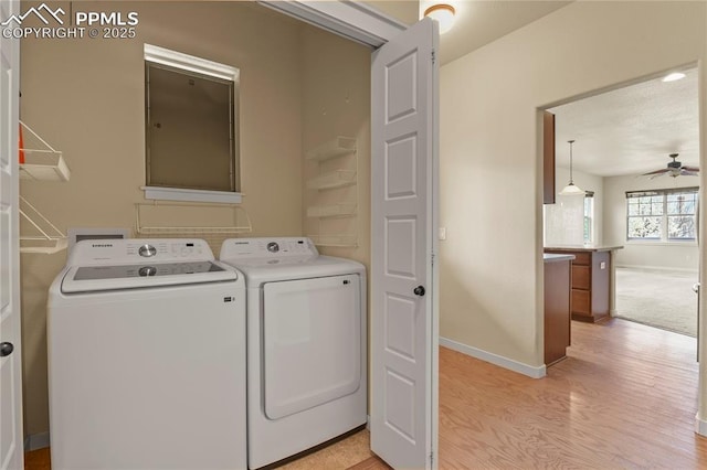 147 Celestine St, Colorado Springs, CO 80905 - washroom with washing machine and clothes dryer, light wood-style flooring, baseboards, and ceiling fan