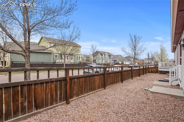 147 Celestine St, Colorado Springs, CO 80905 - view of yard featuring a wooden deck, a fenced backyard, and a residential view