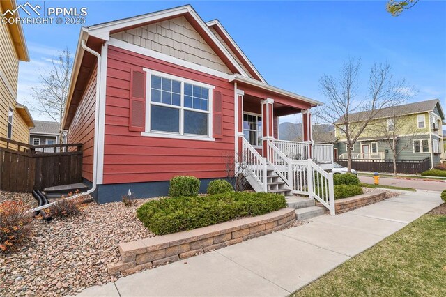 147 Celestine St, Colorado Springs, CO 80905 - view of front facade featuring covered porch and fence
