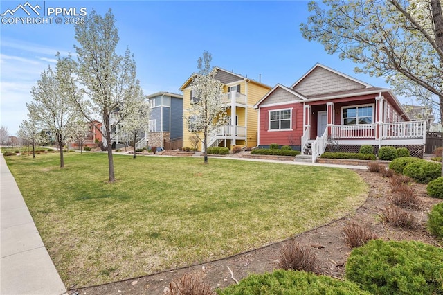 147 Celestine St, Colorado Springs, CO 80905 - view of front facade with a front lawn and covered porch