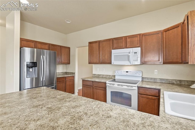 147 Celestine St, Colorado Springs, CO 80905 - kitchen with light countertops, a sink, and white appliances
