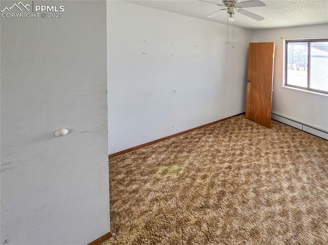 722 6th St, Hugo, CO 80821 - carpeted spare room with a ceiling fan, baseboards, baseboard heating, and a textured ceiling