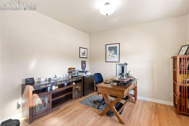 office featuring baseboards and wood finished floors