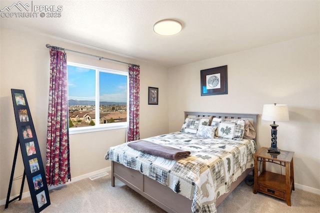 bedroom featuring carpet flooring, baseboards, and visible vents