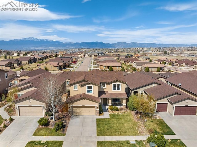 bird's eye view with a residential view and a mountain view