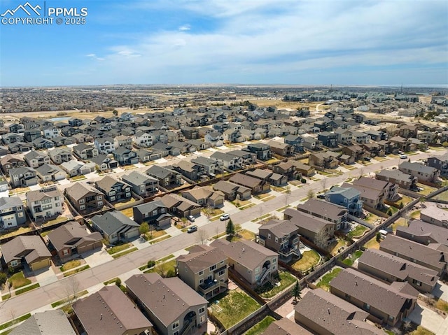 birds eye view of property with a residential view