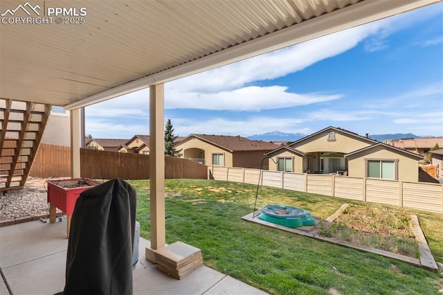 view of yard with a fenced backyard and a patio