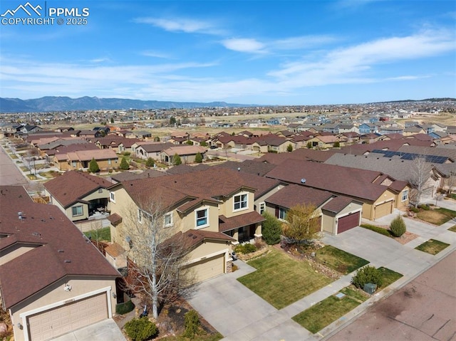 bird's eye view with a mountain view and a residential view