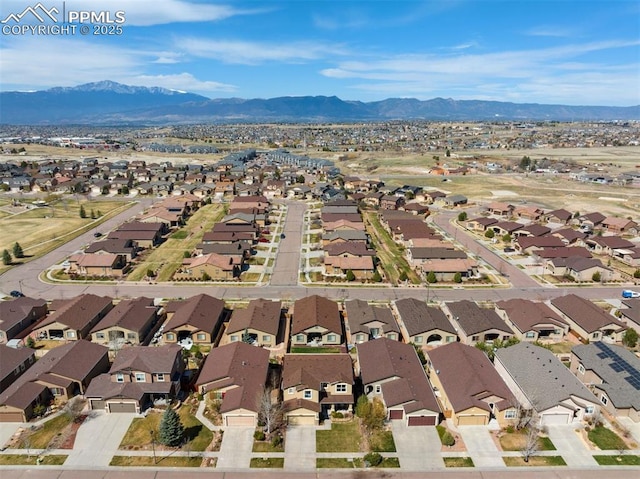 drone / aerial view with a residential view and a mountain view
